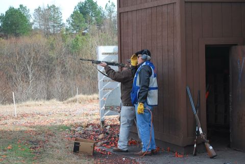 1979 Ford F-150 - Clay pigeon shooting event with participants at the range.