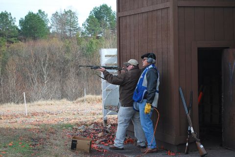 1979 Ford F-150 - A clay shooting event with participants and instructors at the range.