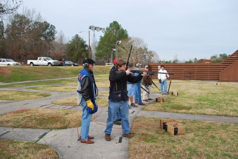 1979 Ford F-150 - Several people are practicing shooting at a skeet range.