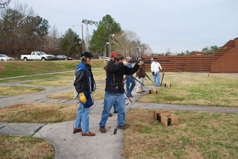 1979 Ford F-150 - A white pickup truck is visible in the background at a shooting range.