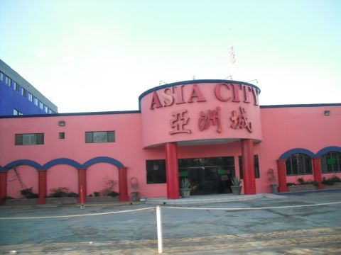 1991 Ford Bronco - The entrance to the Asia City building is visible, with prominent signage in English and Chinese.