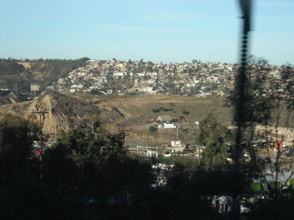 Distant hillside town under a clear blue sky