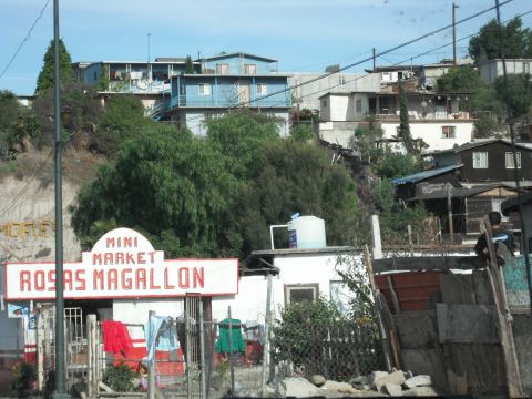 1991 Ford Bronco - A mini market sign is visible on a hillside with houses in the background.