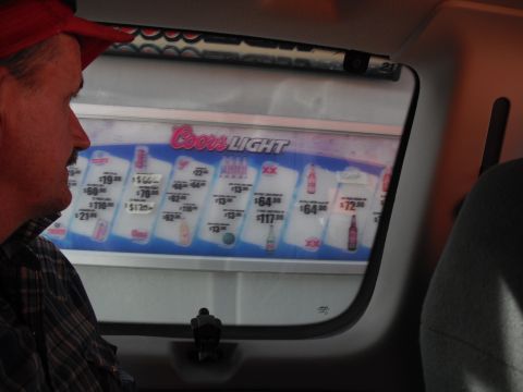 1991 Ford Bronco - Price board for Coors Light beer displays different package sizes and prices.
