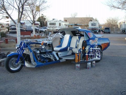 1978 Ford Mustang II - Custom trike a car body and multiple trophies displayed on a shelf.