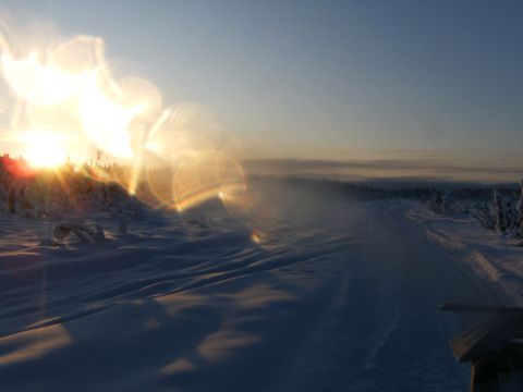 2000 Ford E350 - Sunrise over a snow-covered landscape with a road disappearing into the distance.