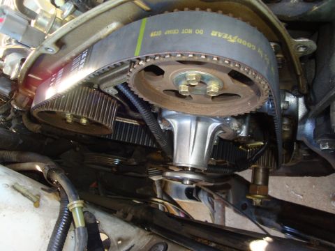 1992 Ford Taurus - Close-up view of an engine's timing belt and water pump assembly.