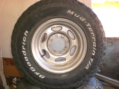 1967 Ford Mustang - A close-up view of a BFGoodrich Mud-Terrain T/A tire mounted on a silver wheel.