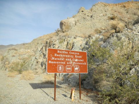 1997 Ford Ranger - A sign marks the entrance to Berdoo Canyon Backcountry Road, warning visitors that resources are protected.
