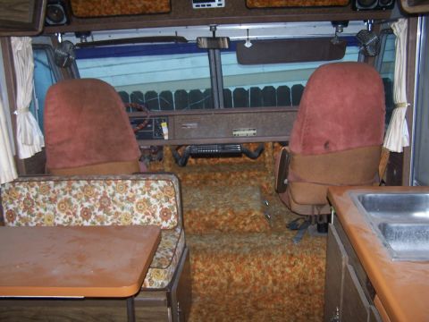 1974 Dodge RV/Conversion Chassis - The interior of a 1974 Dodge RV/Conversion Chassis shows its distinctive 70s styling with shag carpet and floral patterns.