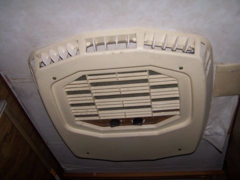 1974 Dodge RV/Conversion Chassis - Interior view of an RV's ceiling-mounted air conditioning unit, adjustable directional vents.