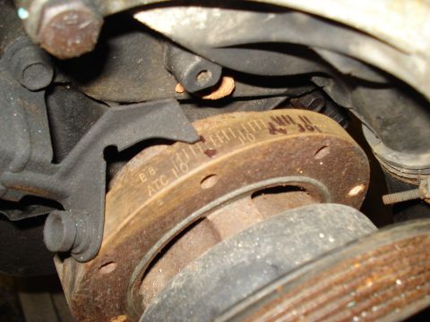 1991 Ford Bronco - Vehicle brake rotor detail with visible part markings.