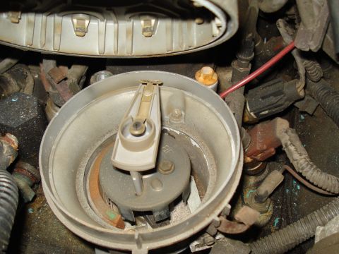 1991 Ford Bronco - Close-up view of a vehicle's distributor cap and rotor, showing internal components.