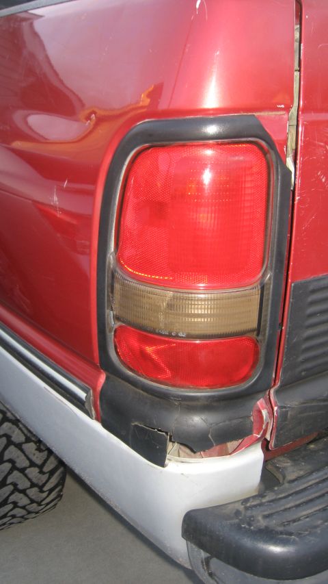 1997 Dodge 2500 - Close-up of the rear passenger side taillight and bumper on a 1997 Dodge 2500 pickup truck.