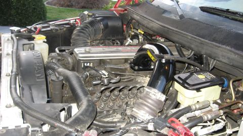 1997 Dodge 2500 - Close-up view of the engine bay, highlighting various mechanical parts and wiring harnesses.