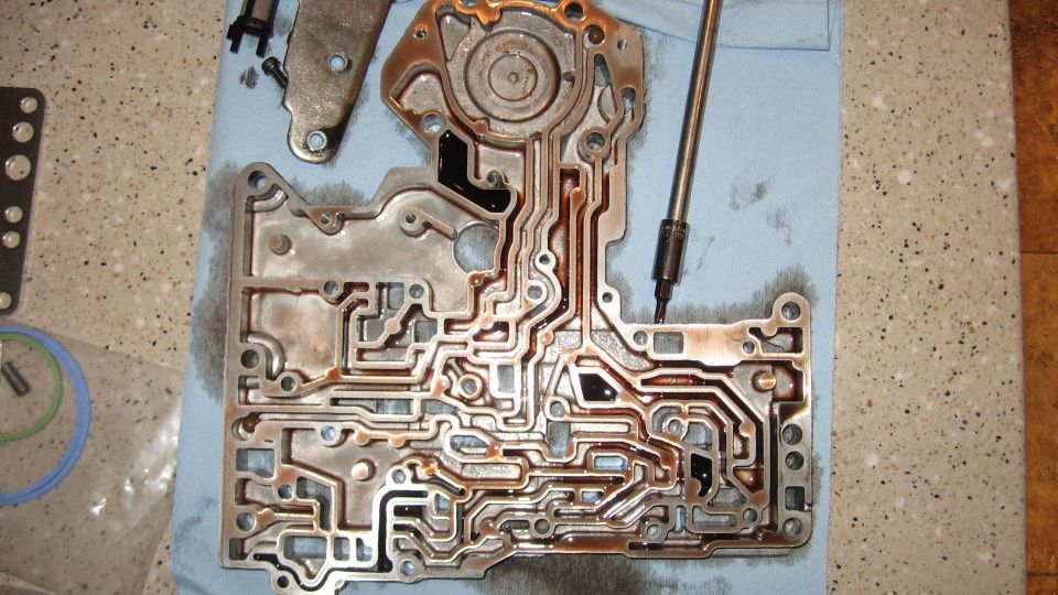 Transmission valve body with intricate fluid channels, some parts removed