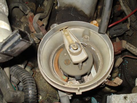 1991 Ford Bronco - Close-up view of a vehicle's distributor cap and rotor, showing internal components.