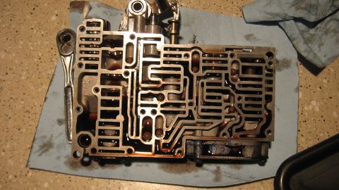 1997 Dodge 2500 - Automatic transmission valve body with a ratchet on a blue shop towel.