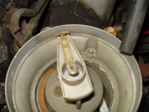 1991 Ford Bronco - Close-up view of a vehicle's distributor cap and rotor, showing internal engine components.