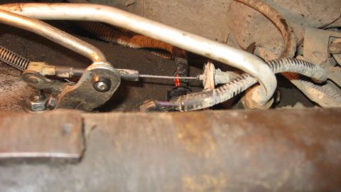 1997 Dodge 2500 - This photo shows a close-up view of a vehicle's throttle cable linkage mechanism.