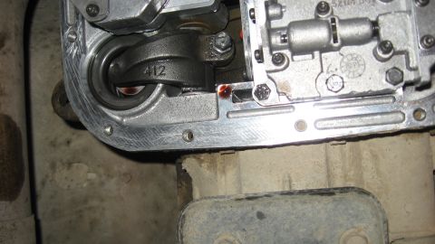 1997 Dodge 2500 - Close-up view of transmission pan internals, showing linkage and a SuperMotors.net watermark.