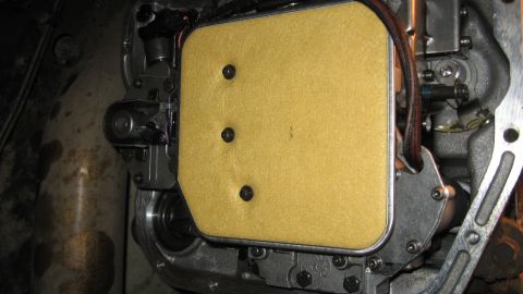 1997 Dodge 2500 - Close-up of a transmission filter assembly, showing internal components and a dark hose.