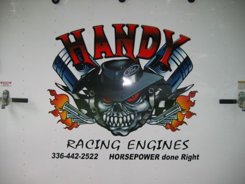 1992 Ford Mustang - Graphic on a white surface with text about racing engines and a phone number.