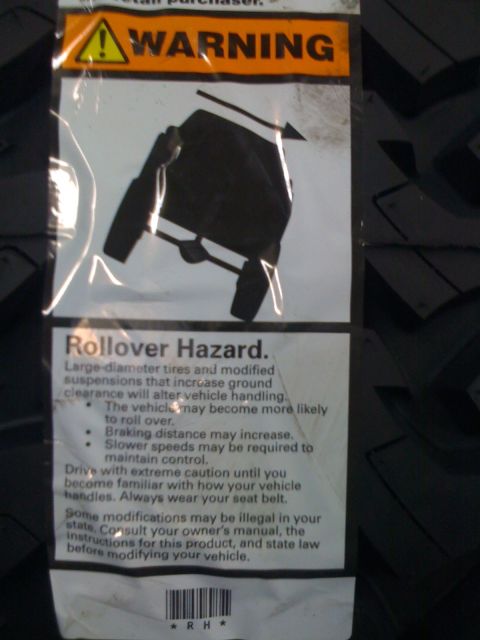 1996 Ford C-350 (Centurion Conversions) - This label warns about rollover hazards associated with tire and suspension modifications.