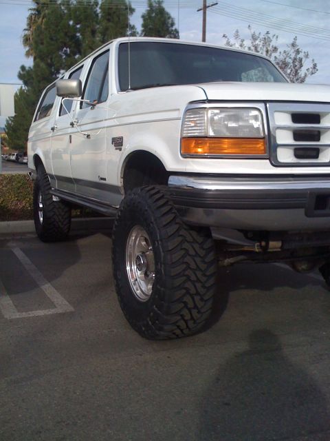 1996 Ford C-350 (Centurion Conversions) - This lifted 1996 Ford C-350 Centurion Conversions is equipped with substantial off-road tires, giving it an imposing stance.