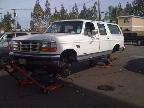 1996 Ford C-350 (Centurion Conversions) - White 1996 Ford C-350 (Centurion Conversions) undergoing maintenance with all wheels off.