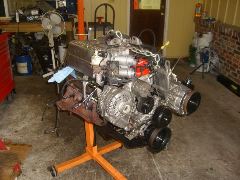 1994 Ford Bronco - Engine assembly is mounted on a stand in a workshop environment.