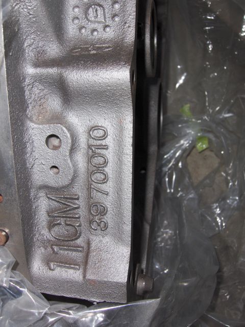 1970 Chevrolet Camaro - Close-up of a metal engine block casting showing stamped identification numbers.