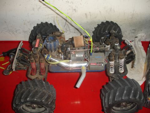 1989 Ford Bronco - The internal components of a remote control monster truck are visible from a top-down perspective.