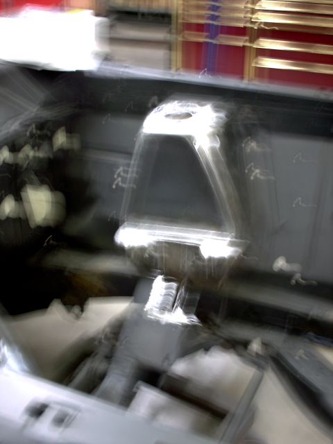 1963 Ford Fairlane - The interior of a car is captured in a motion-blurred photograph, showing the dashboard and central console.