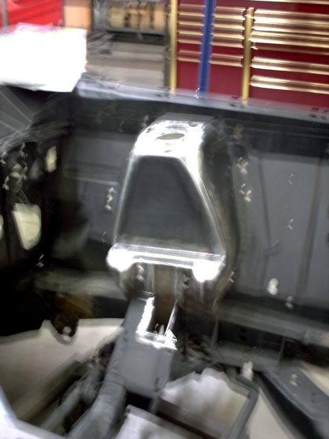 1963 Ford Fairlane - The engine bay of a vehicle, showing structural components and bracing.