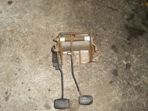 1994 Ford Bronco - This assembly features two pedals, a brake and a clutch, mounted on a metal bracket with springs.