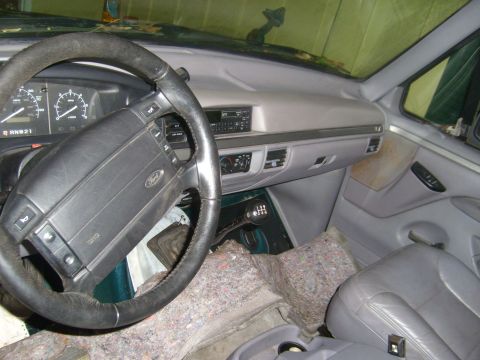 1994 Ford Bronco - Interior view of a 1994 Ford Bronco, the dashboard and driver's seat.