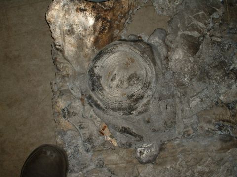 1963 Ford Fairlane - A close-up view of a heavily corroded tire and rim, possibly from a vintage vehicle.