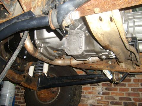 1994 Ford Bronco - This image shows the underside of a vehicle, focusing on the transmission and suspension system.