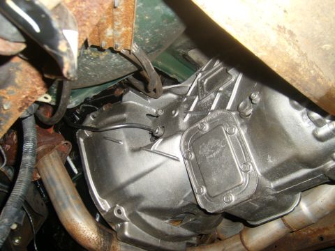 1994 Ford Bronco - Underside view of a vehicle's transmission and exhaust system, showing some signs of wear and rust.