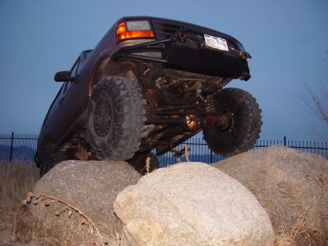 1993 Ford Bronco - This modified truck is shown navigating a rocky obstacle course.