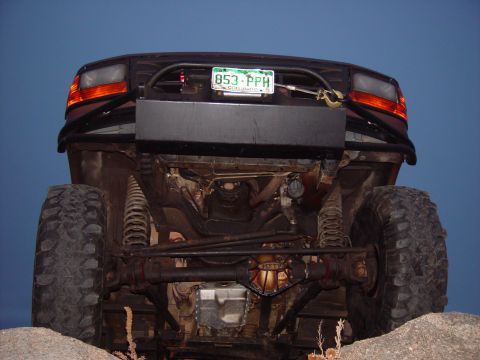 1993 Ford Bronco - This 1993 Ford Bronco features a custom rear bumper and large off-road tires, its modified undercarriage.