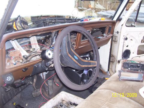 1978 Ford Bronco - The interior of a 1978 Ford F-Series truck shows a disassembled dashboard and exposed wiring.