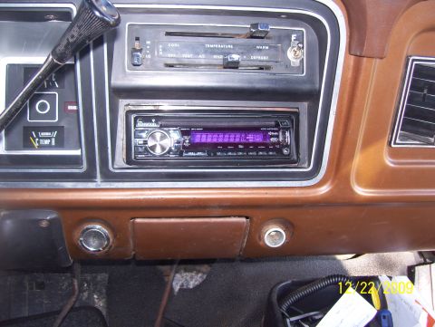 1978 Ford Bronco - The dashboard interior shows an aftermarket stereo and climate controls, with a visible date stamp.