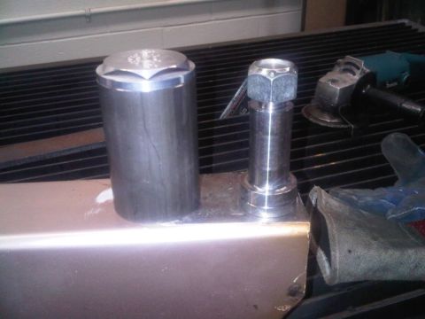 1996 Ford Bronco - Metal components and a grinder are visible on a workbench, suggesting a mechanical or fabrication setting.