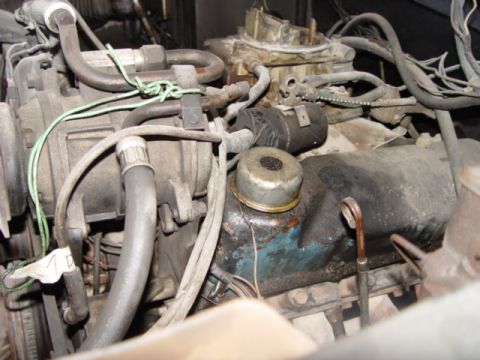 1996 Ford Bronco - Close-up view of a vehicle's engine bay, showing various components and wiring.