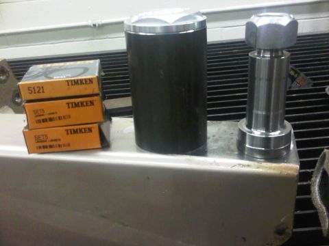 1996 Ford Bronco - Several automotive parts, including Timken brand components, are displayed on a metallic surface.