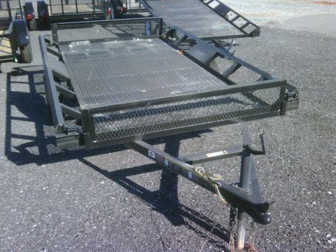2004 Ford F-150 - Two car hauler trailers are visible, one in the foreground and another behind it.