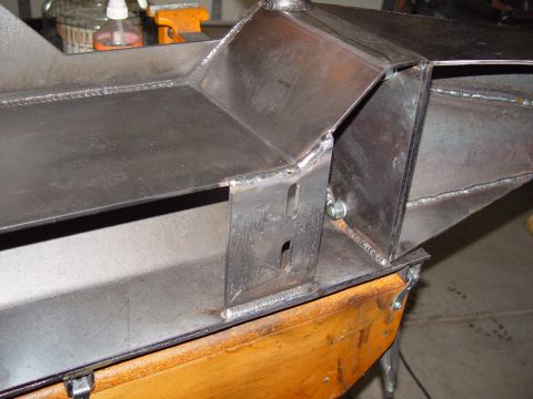 1993 Ford Bronco - Detail of a custom-fabricated metal bumper, showing welded seams and bracketry.