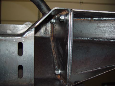 1993 Ford Bronco - Welded metal frame section with visible bolts and bracketry.